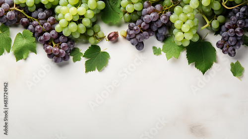 Top view of purple grapes on a white background with copy space for text