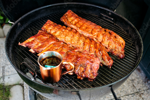 Beef Ribs und Spare Ribs am Grill - Beef Ribs and Spare Ribs on the grill photo
