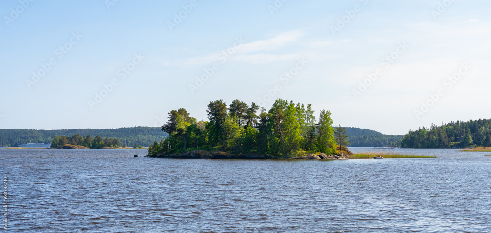 Small rocky islands overgrown with trees on Lake Ladoga