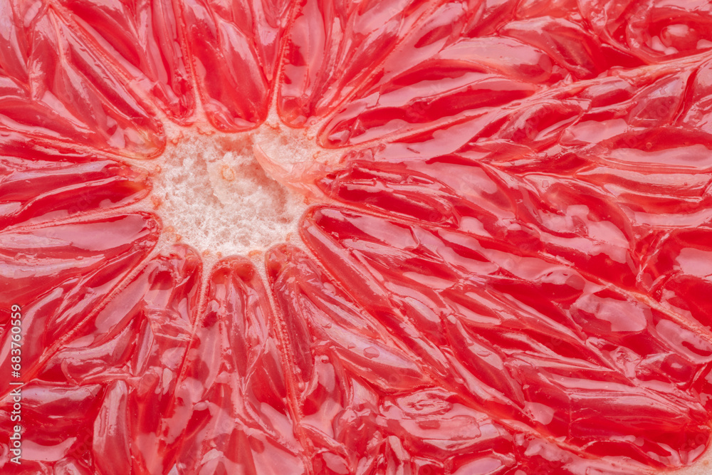 Juicy segmented flesh of grapefruit closeup. Food background. Juicy segmented flesh of grapefruit closeup. Food background.