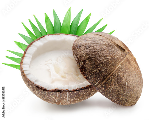 Coconut milk splash spraying from cracked coconut fruit. File contains clipping path.
