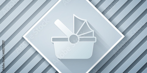 Paper cut Baby stroller icon isolated on grey background. Baby carriage, buggy, pram, stroller, wheel. Paper art style. Vector