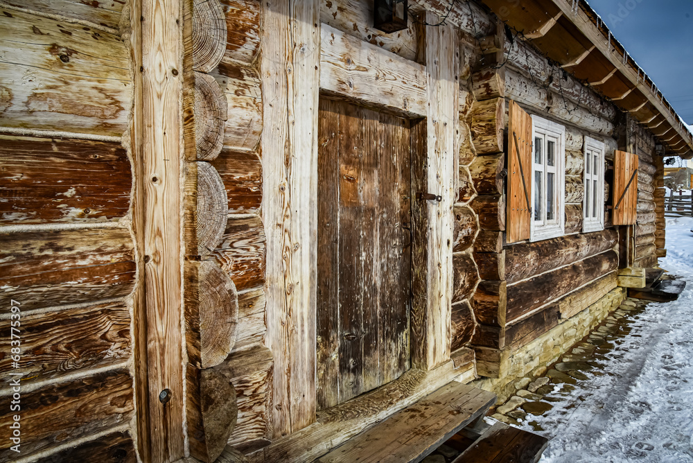 Wooden house in the Ukrainian Carpathians in winter. Wooden hut under the snow. Wooden house in the Ukrainian Carpathians in winter. Wooden hut under the snow.