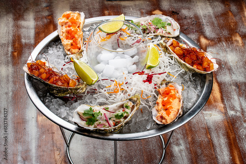 Trio Ceviche, marinated seafood dish, scallop, sea bass, tuna. Haute cuisine. On a wooden background.
