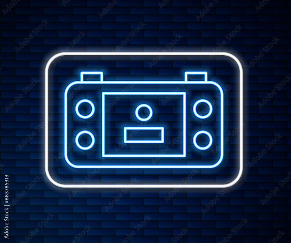 Glowing neon line Portable video game console icon isolated on brick wall background. Handheld console gaming. Vector Glowing neon line Portable video game console icon isolated on brick wall background. Handheld console gaming. Vector