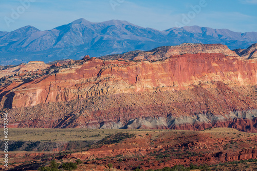 Sandstone rock formation in the American Southwest. Establishing image of the high desert showing massive rock formations with sparse juniper and sagebrush vegetation © kmlPhoto