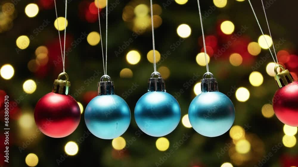 Christmas Balls Swinging Pendulum Against Tree Christmas Balls Swinging Pendulum Against Tree