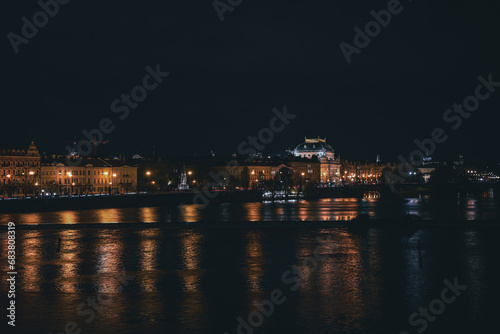 Night view of Prague's Old Town and the National Theater from Charles Bridge.