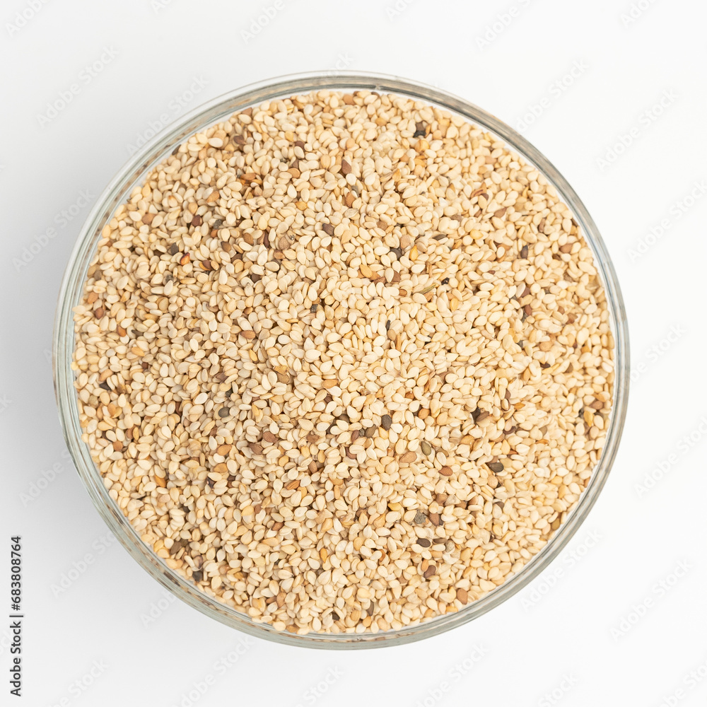 Sesame seeds on on glass plate isolated on a white background
Sesame seeds on on glass plate isolated on a white background