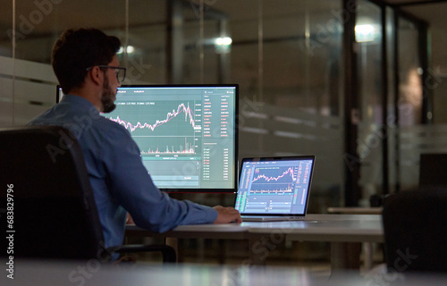 Картината върху платно Business man trader broker analyst investor using computer analyzing stock trade crypto market investing finances working in dark night office