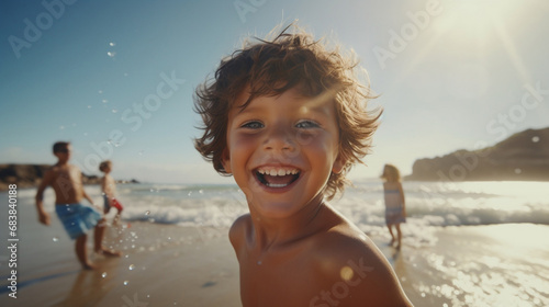 happy smiling laughing child playing on defocused bokeh beach background © BeautyStock