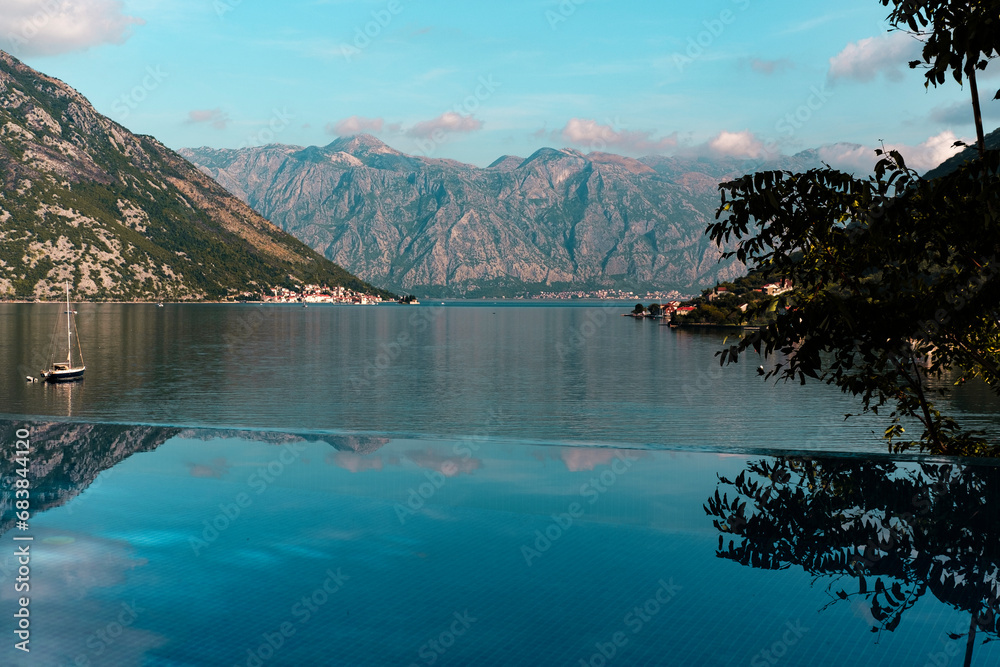 autumn landscape in montenegro, kotor bay, mountains, sail boats, stone houses, sunny fall velvet season