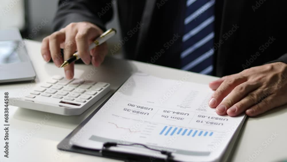 Businessman checking financial accounting documents and analyzing budget planning. Finance and Accounting Businessman checking financial accounting documents and analyzing budget planning. Finance and Accounting