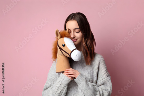 Girl hobbyhorsing on solid color background. ai generative photo