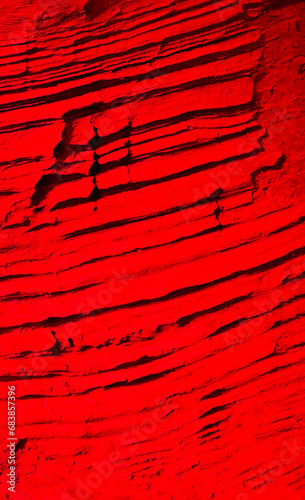 Red rock, stone background. Natural Textured rock in read color photo