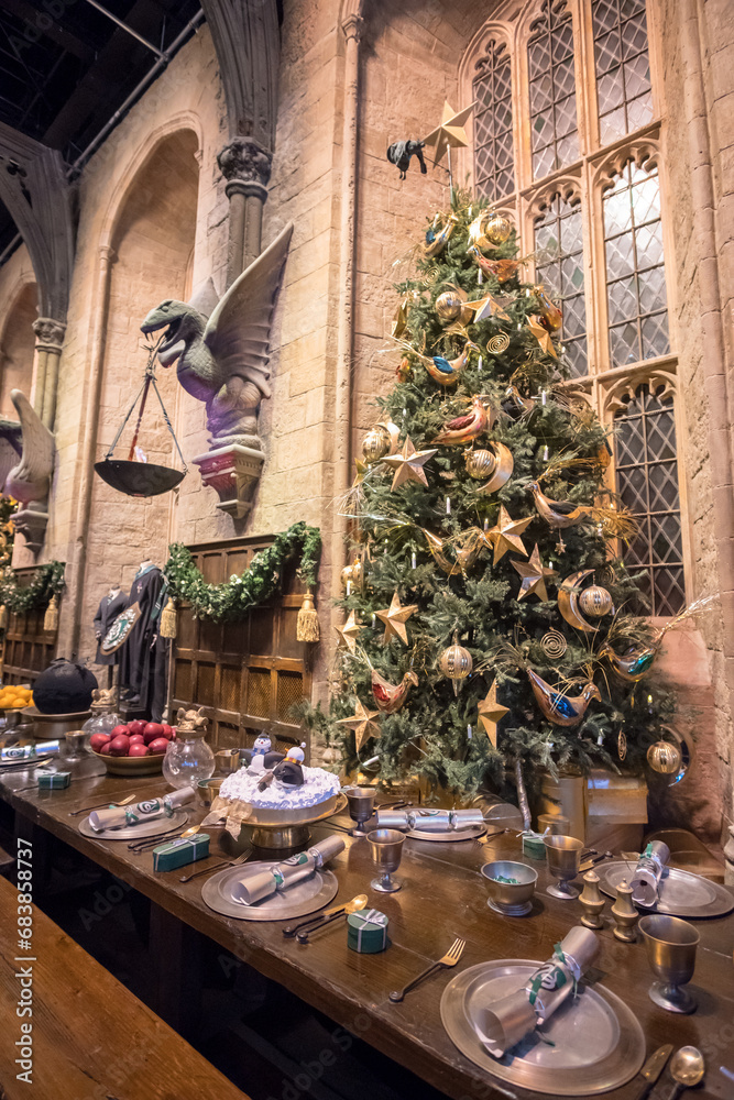 Fototapeta premium London, England - 18 November 2017: Christmas Decoration in the Great Hall of Hogwarts in Warner Brothers Studio tour, The making of Harry Potter at Leavesden Studio in London.