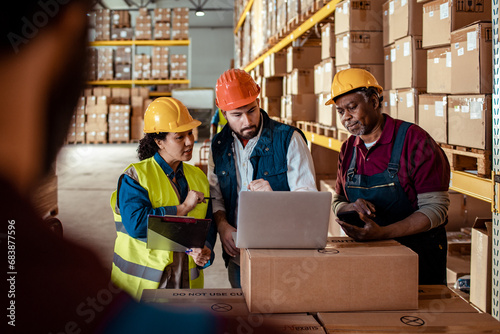 Team of Warehouse Employees Discussing Logistics Operations photo