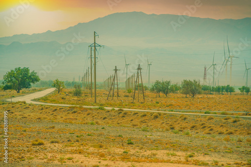 Wind turbines use energy from renewable sources. The beauty of nature meets sustainable technologies. A serene and picturesque landscape with a touch of eco-friendliness.