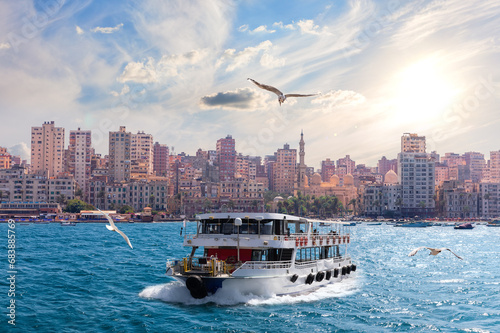Obraz na płótnie Cruise ship by the shore of the sea, area of he Abu al-Abbas al-Mursi Mosque in Alexandria, Egypt w salonie