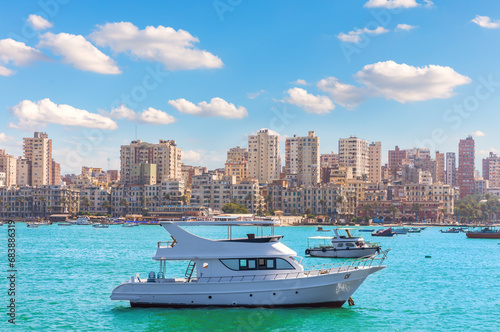 Boats in the harbour is the populated city district of Alexandria by the Mediterranean sea, Egypt