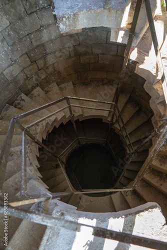 Creepy dusty hexagonal stairs on an abandoned building