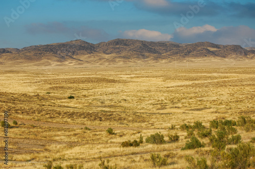 Steppe, prairie, When the sun sets and colors the sky in breathtaking hues, you know you're in the heart of a stunning desert surrounded by towering mountains Nature's Canvas