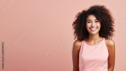 Afro-american woman model wearing a pink sundress isolated on pastel