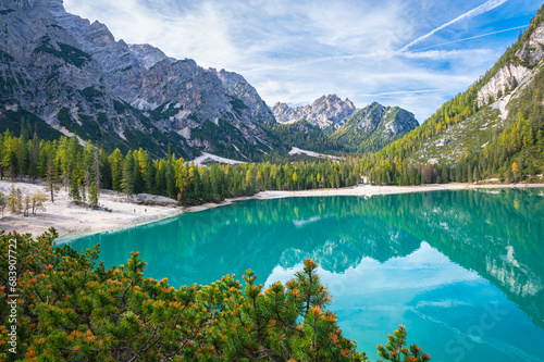 Striking view of a blue colored lake in Italy's Dolomites on a day in October 