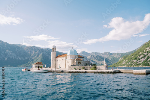 Island of Gospa od Skrpjela in the Bay of Kotor with the mountains in the background. Montenegro