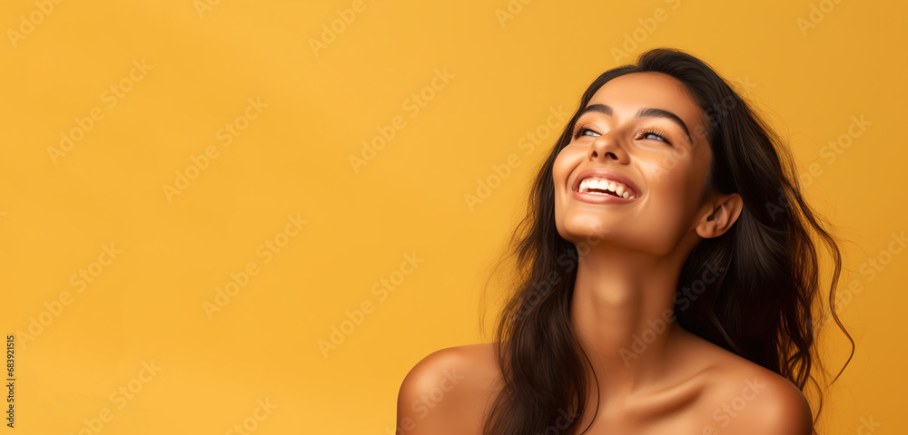 Portrait of young happy Indian woman, Skin care beauty, skincare cosmetics, dental concept, isolated over yellow background. Copy space. Portrait of young happy Indian woman, Skin care beauty, skincare cosmetics, dental concept, isolated over yellow background. Copy space.