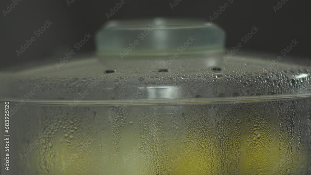 Through the Glass: A Close-Up of container, steamer for cooking vegetables Through the Glass: A Close-Up of container, steamer for cooking vegetables