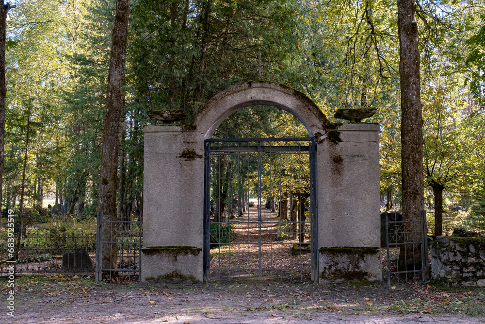 cemetery gate, forest graveyard, old Latvia cemetery, massive entrance