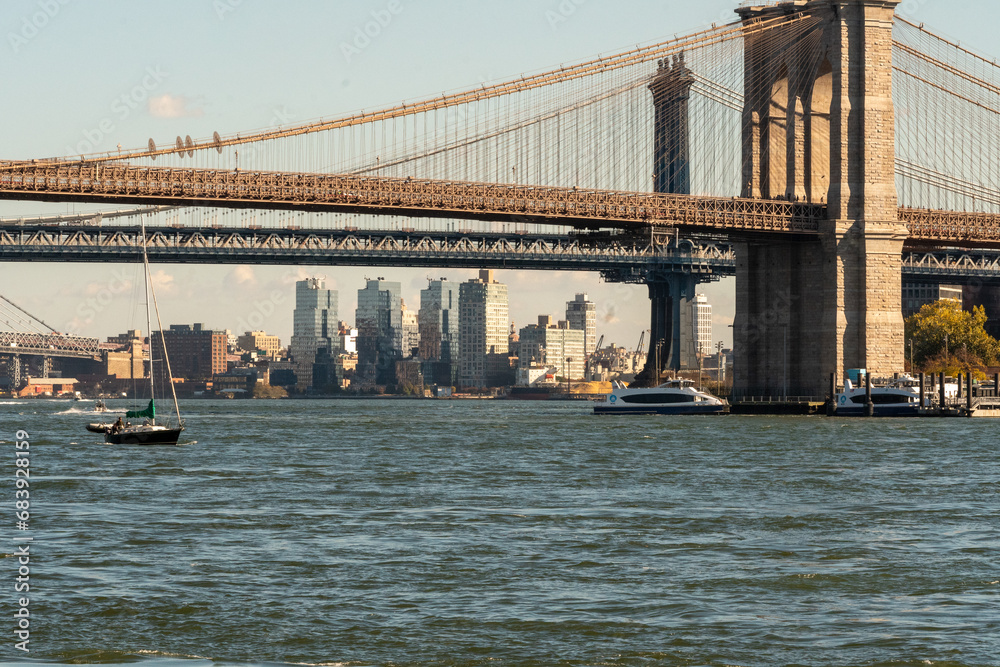 Naklejka premium The Manhattan bridge and the Brooklyn Bridge as seen from a ferry on the East River