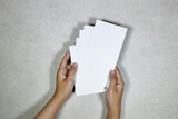 hands holding a Mockup of business cards stack 