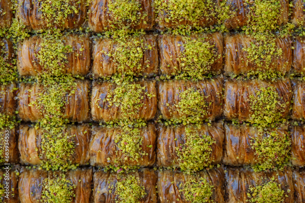Top view of fresh baklava made in rectangular shape, overhead shot of fresh baklava with plenty of pistachios