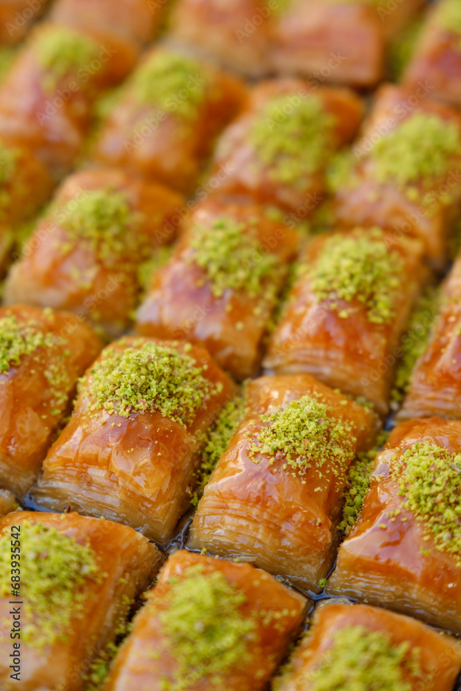 Cross shot of fresh baklava from above, Shot of freshly baked handmade baklava with lots of pistachios Cross shot of fresh baklava from above, Shot of freshly baked handmade baklava with lots of pistachios