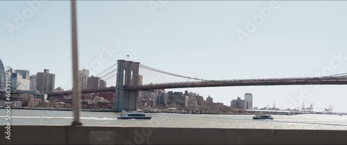 4K 2.39 60@24fps_NYC Driving Shot of Brooklyn Bridge and Ferries in the East River