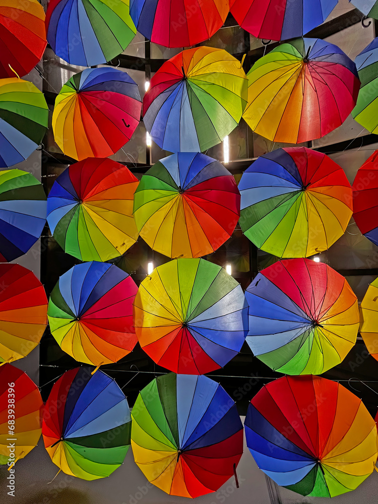 Fototapeta premium Rainbow umbrellas in an alley in Antalya.