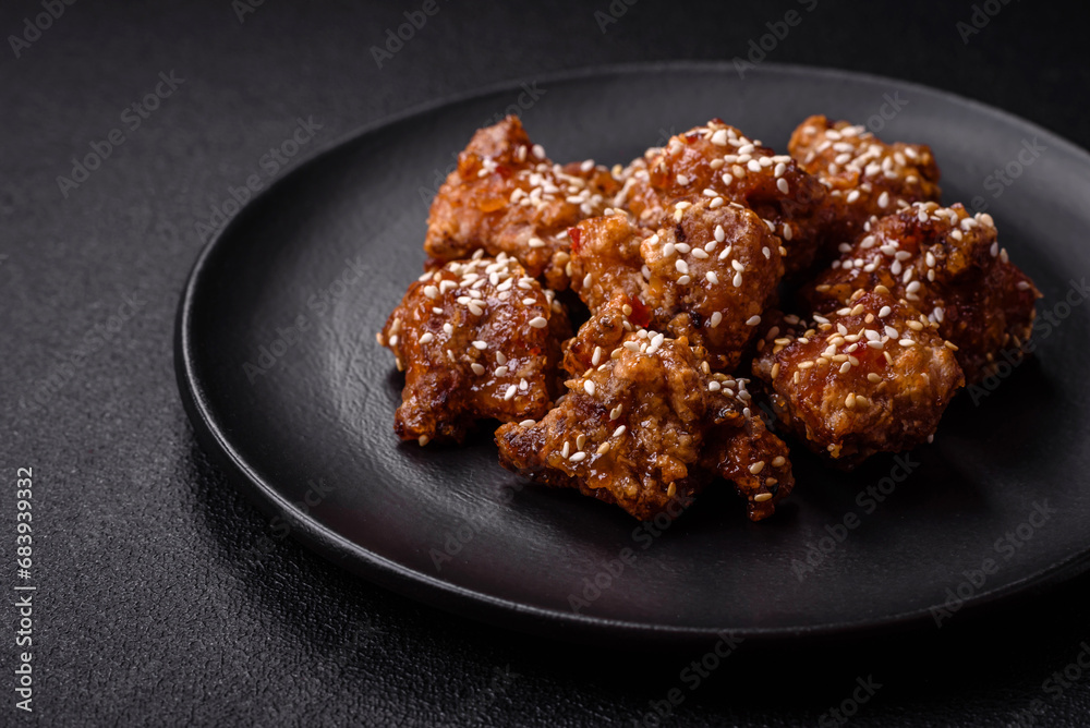 Delicious Asian dish with pieces of chicken in teriyaki sauce with salt and spices Delicious Asian dish with pieces of chicken in teriyaki sauce with salt and spices