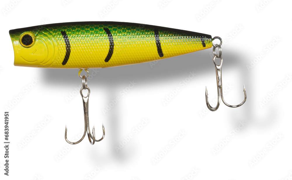 Large artificial bait used by anglers on the water's surface with shadow below Large artificial bait used by anglers on the water's surface with shadow below