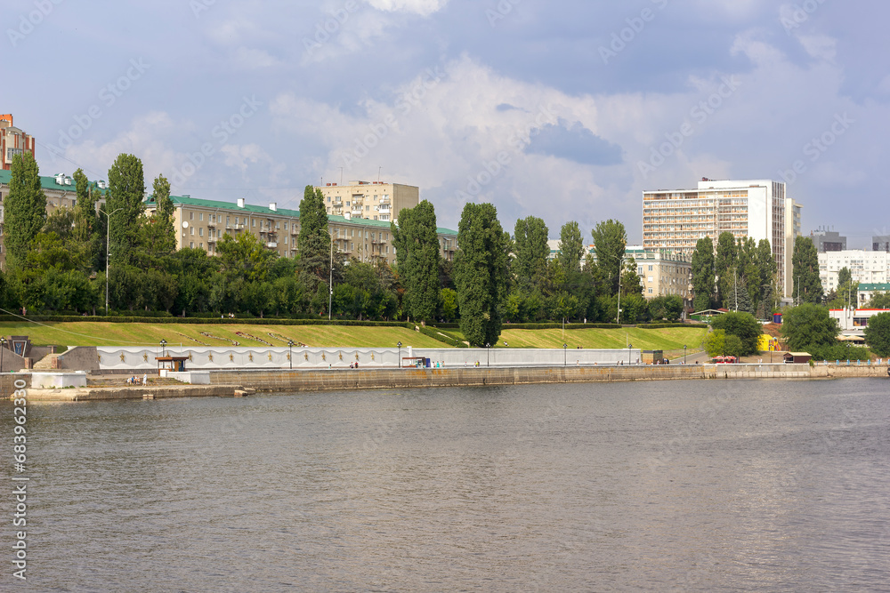 embankment of a large city along the river in summer