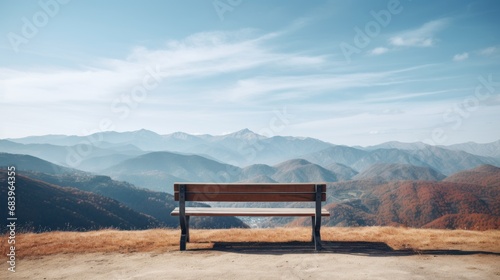 a wooden bench sitting on top of a dry grass covered field next to a lush green valley filled with mountains.