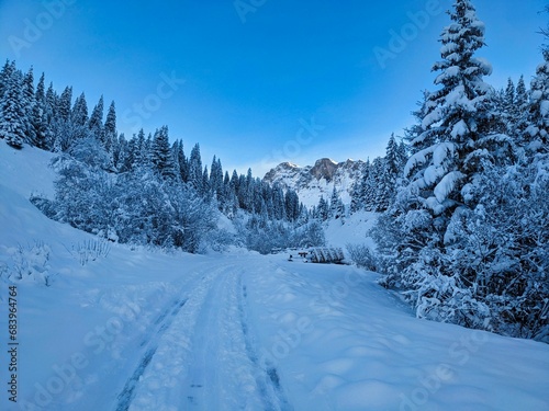 Snowy road from St.Antönien Luzein towards Partnun with a view of the mountain Schijenflue. High quality photo photo