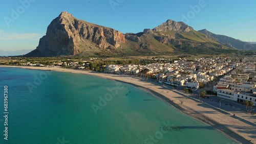 Aerial shot of famous San Vito Lo Capo - beach and town in Sicily, Italy. Beach with turquoise water at the foot of the mountain in San Vito Lo Capo - tourist pearl of western Sicily photo