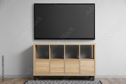 Modern smart TV set hanging...