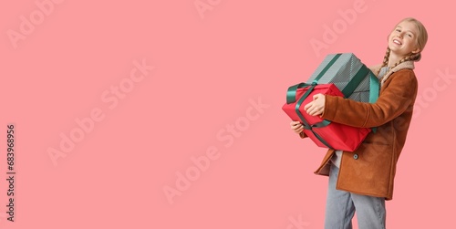Pretty young girl holding C...
