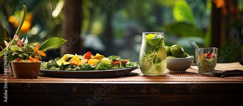 In the lush tropical garden, surrounded by vibrant green leaves and woody plants, one could bask in the beauty of nature while enjoying the healthy and delicious Asian cuisine prepared from fresh photo