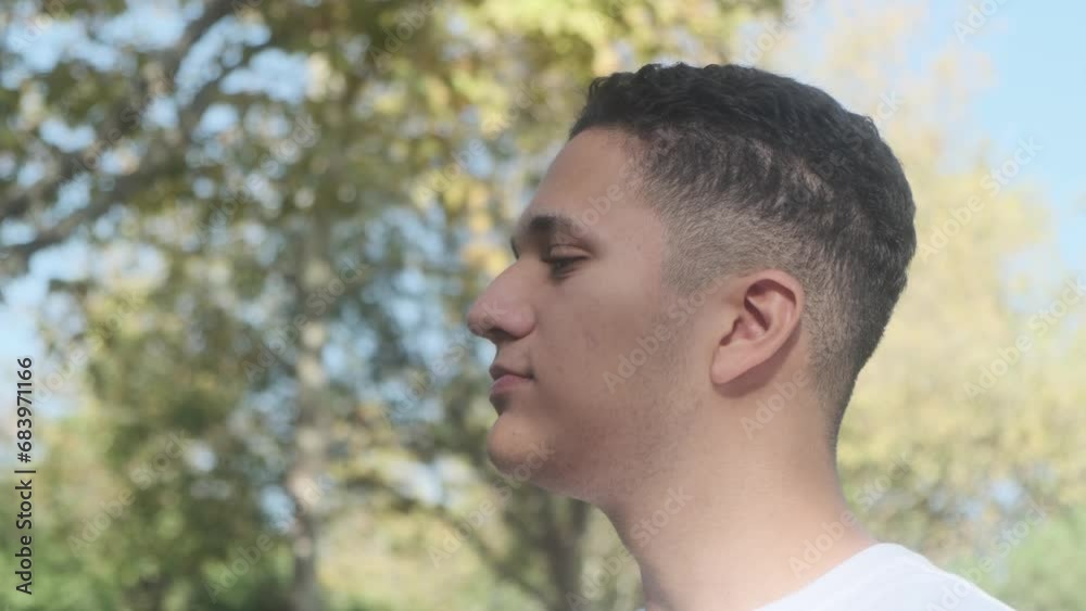 man eating snack in the park