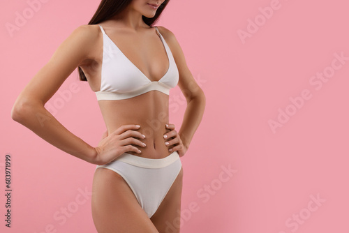 Young woman in stylish white bikini on pink background, closeup. Space for text