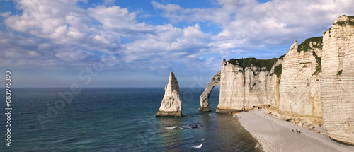 Aerial 4k drone view of Etretat, Normandy, France. L'Aiguille, The Needle, Famous Alabaster chalk seacoast, Porte Aval cliffs, Natural Rock Arch Of Étretat, Atlantic Ocean, French holidays, landscape